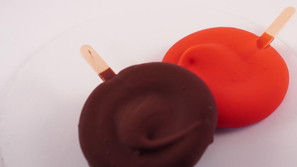 Ice Cream Bar · Vanilla custard frozen on a stick with your choice of dip.