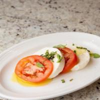 Caprese · Fresh mozzarella, tomatoes, olive oil, basil.