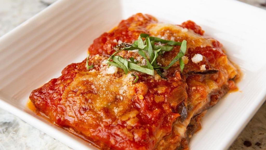 Parmigiana Di Melanzane · Baked eggplant, tomato sauce, fresh 
mozzarella.