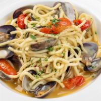 Spaghetti Alla Vongole · Clams, garlic, cherry tomatoes, white wine, chili flakes.