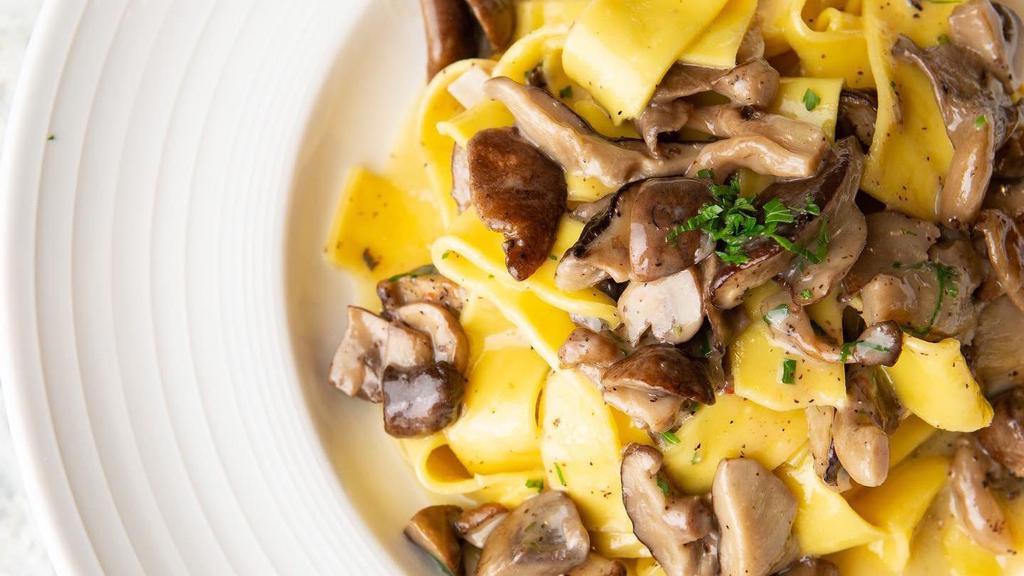 Pappardelle Ai Funghi · Medley of wild mushrooms, white wine creamy sauce.
