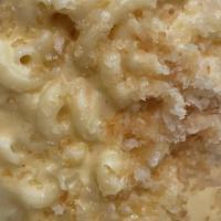 Mac N Cheese · Topped with our signature, gooey mac n cheese.