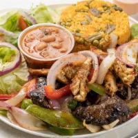 Grilled Steak & Chicken  (Pluma Y Pelo) · Fresh grilled chicken and steak, sauteed with onions and peppers. Comes with rice, beans, an...