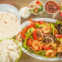 Mixed Fajitas · Fresh grilled, steak, shrimps, chicken, with sides of rice, beans, lettuce, pico de gallo, s...