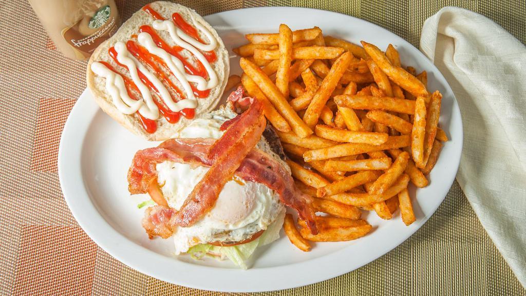 Texas Burger · Burger, cheese, let, tomatoes, bacon, fried egg ,mayo ,ketchup.