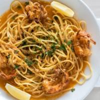 Shrimp Scampi Over Linguini · Jumbo Shrimp Sauteed in Lemon, Garlic, Butter and White Wine over Linguini