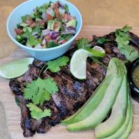 Carne Asada · marinade skirt steak, avocado salad, tomatillo salsa, hand made corn tortilla