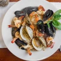 Pescatore · Shrimp, clams and mussels sautéed with garlic and extra virgin olive oil, with diced plum to...