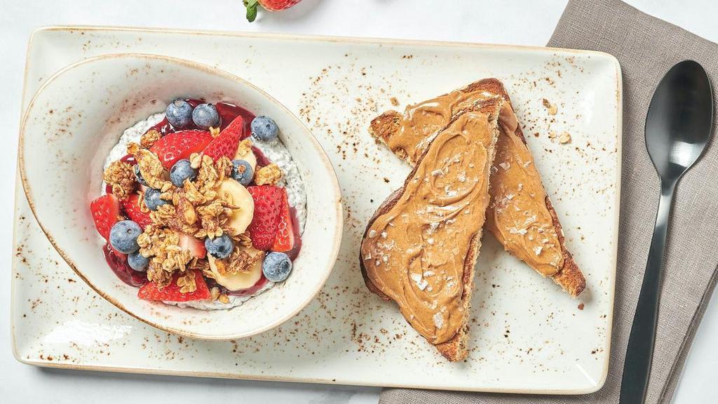 Am Superfoods Bowl · Coconut milk chia seed pudding topped with fresh bananas, berries, blackberry preserves, and house made granola. Served with whole grain artisan toast topped with almond butter and Maldon sea salt.