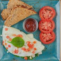 Healthy Turkey · Egg white omelet with turkey, house-roasted onions, tomatoes, spinach and Feta. Served with ...