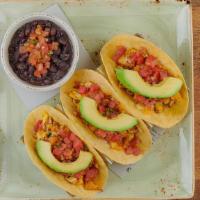 Farm Stand Breakfast Tacos · Three wheat-corn tortillas with cage-free scrambled eggs, Cajun chicken, chorizo, Cheddar an...