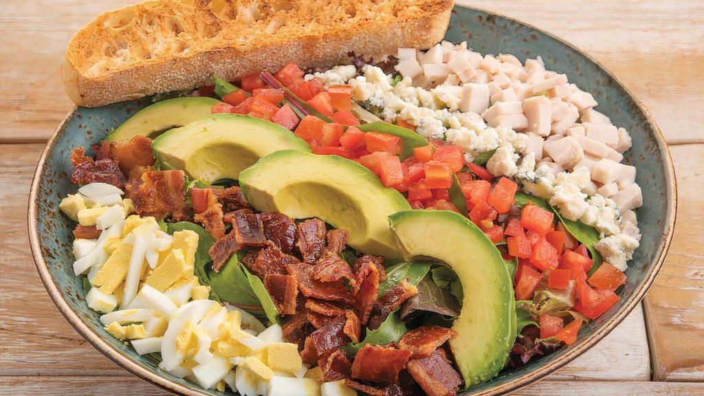 Cobb Salad · Organic mixed greens, bacon, turkey breast, egg, tomatoes, avocado and Bleu cheese crumbles with ranch dressing. Served with artisan ciabatta toast.