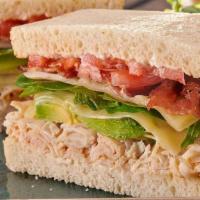 Monterey Club Sandwich · Turkey, bacon, avocado, organic mixed greens, tomato, Monterey Jack, and mayo on sourdough. ...