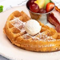 Kids Waffle · A half portion of our fluffy Belgian waffle,. served with fresh fruit and your choice of bac...