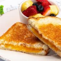 Kids Grilled Cheese · Ooey-gooey cheese melted between two pieces. of grilled sourdough bread. Served with fresh. ...