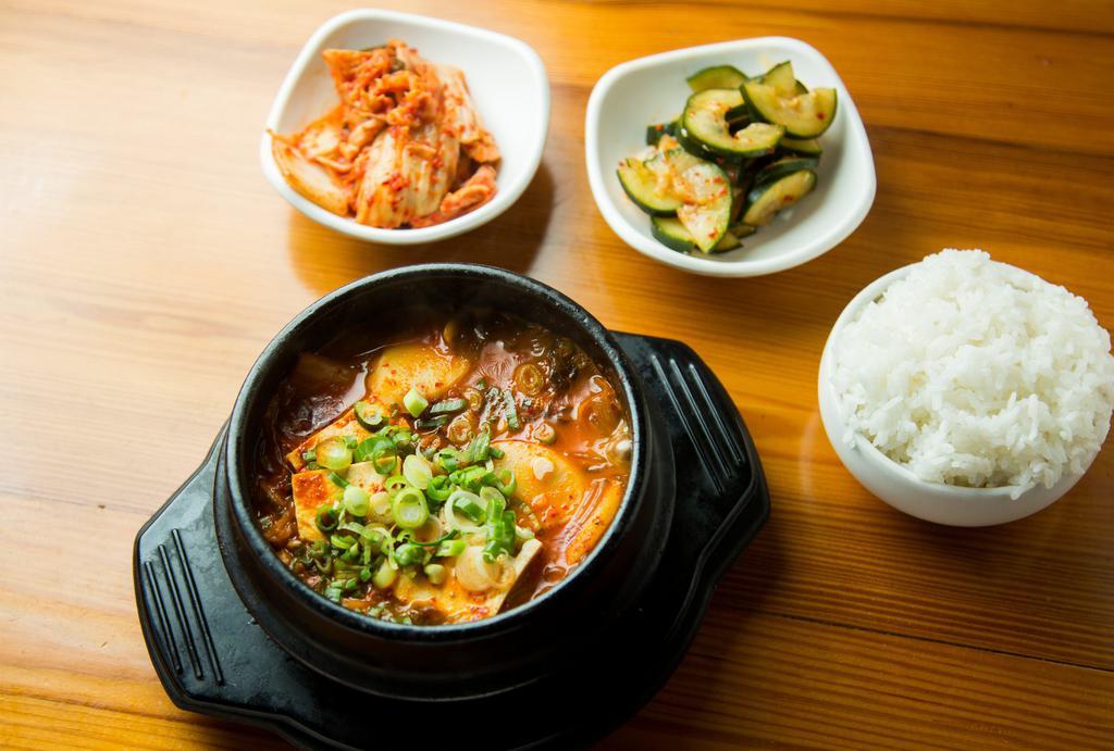 Kimchi Jjigae · Spicy. Kimchi and pork belly soup.