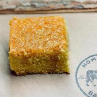 Corn Bread · WITH HONEY BUTTER. (PER SLICE). CONTAINS DAIRY + GLUTEN