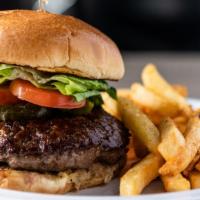Beef Burger · Grilled ground beef on a toasted brioche bun. Topped with lettuce, pickles & tomato