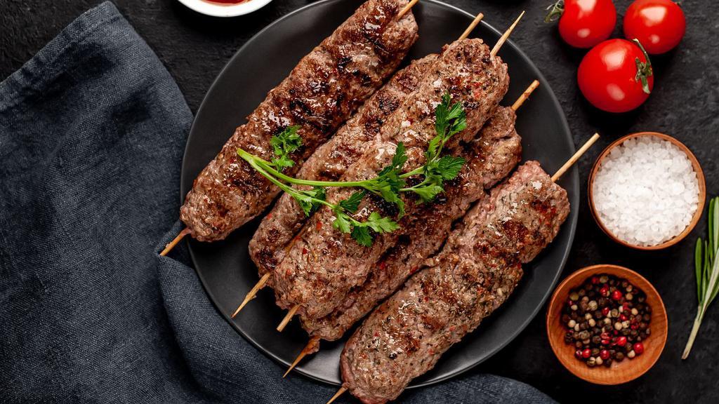 Lamb Seekh Kebab · Ground lamb seasoned with ginger, garlic, red onions and cilantro.