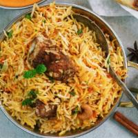 Goat Biryani · Delicious fresh basmati rice with marinated goat with Indian herbs and spices.