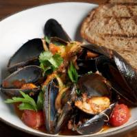 Mussels · Tomatoes, white wine, fine herbs, grilled sourdough bread