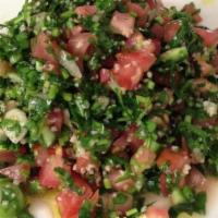Tabouleh · fine chopped parsely,tomatoes,onions,bulghur wheat with a lemon,olive oil,and mint dressing