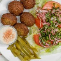 Falafel Dish · 5 homemade falafel balls fried to order served with house salad ,tahini sauce,pickes and pit...