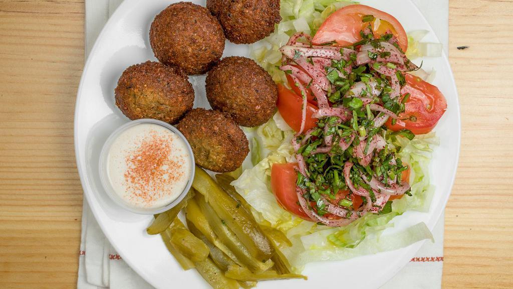 Falafel Dish · 5 homemade falafel balls fried to order served with house salad ,tahini sauce,pickes and pita bread
