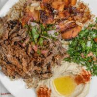 Mixed Shawarma Combo · thin sliced meat perfectly marinated  on top of rice w vermicceli  or salad served with sauc...