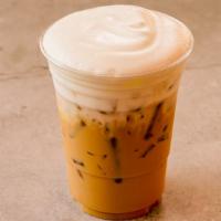 Iced Cappuccino · Rich, dark espresso with steamed milk foam over ice.