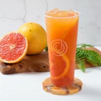 Grapefruit Sunset  · Freshly squeezed grapefruit juice with Jasmine green tea. 

Grapefruit slices and pomelo bit...