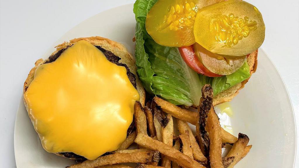 Burger With Fries · Grilled 8 oz burger on a toasted brioche bun with lettuce, tomato, pickles, and hand cut fries with a choice of cheese.