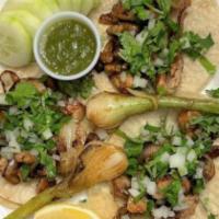 Small Tacos Lunch · 3 tacos, any choice of meat topped with cilantro and diced onions.