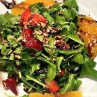 Strawberry Salad · Sliced strawberries, orange segments, baby arugula and pecans with a balsamic reduction dres...