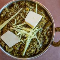 Sarso Da Saag & Makki Di Roti (Vegetarian) · Fresh mustard leaves, cooked with Indian spices and served with com flour roti.