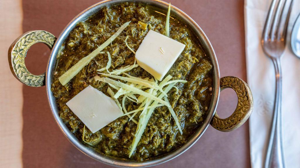 Sarso Da Saag & Makki Di Roti (Vegetarian) · Fresh mustard leaves, cooked with Indian spices and served with com flour roti.
