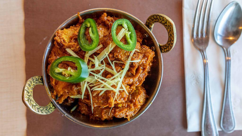 Kadai Chicken · Tender pieces of chicken simmered with green peppers, onions, tomatoes, ginger, garlic cooked Punjabi style.