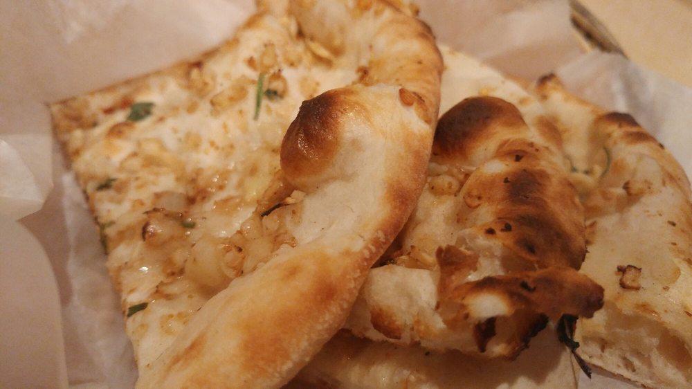 Garlic Naan · Fresh dough topped with garlic.