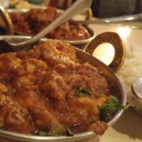 Chicken Curry · White boneless chicken spiced and cooked in light gravy.