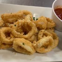 Tuscan Fried Calamari · Calamari marinated in buttermilk, coated in tuscan spices and served with  marinara sauce ho...