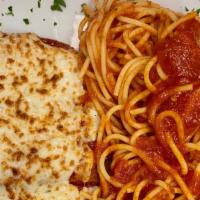 Eggplant Parmesan · Crisp fried eggplant  baked with marinara sauce and mozzarella cheese served with spaghetti ...