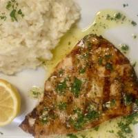Grilled Swordfish · Grilled swordfish topped with Italian green sauce served with risotto parmesan or vegetables.