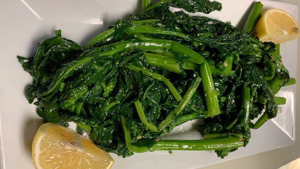 Sautéed Spinach · Fresh spinach sautéed with garlic, imported olive oil and lemon