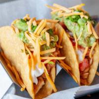 Creamy Chicken Taco · Chicken, pico de gallo, sour cream, cheese, guacamole.