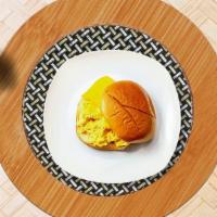 Cheesy Egg Sandwich · Scrambled egg and cheese on a bread.