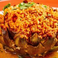 Stuffed Artichoke · Trimmed and stuffed with herb parmigiana breadcrumb stuffing and then baked to perfection
wi...