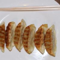 Gyoza(6Pcs) · Pan fried pork dumplings.