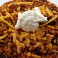 Turkey Chili · Served with Sour Cream, Cheddar, & Chips.