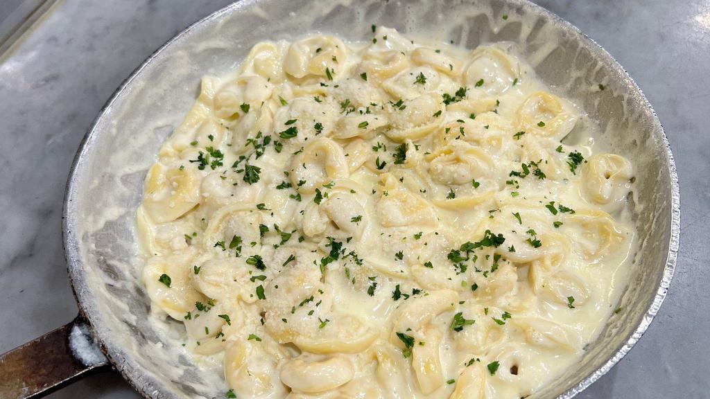 Stuffed Tortellini Alfredo · Tasty cheese tortellini with alfredo sauce and fresh Parmesan cheese. That's Delicious!