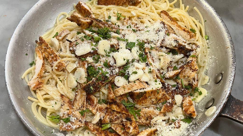 Blackened Chicken Garlic And Oil · Fire roasted blackened chicken breast seasoned well with balsamic vinegar and garlic toasted in a delicious garlic and oil mix over spaghetti. That's Delicious!